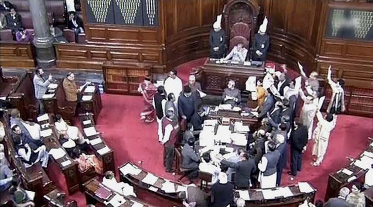 Opposition members protest in the well of the Rajya Sabha in New Delhi on Monday.(Source: PTI)