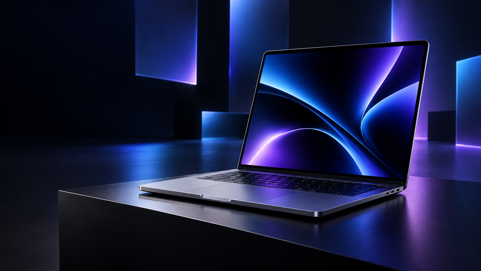 Premium laptop on a dark presentation stage with blue and violet lighting for Apple’s October 28 Pro and Tell event